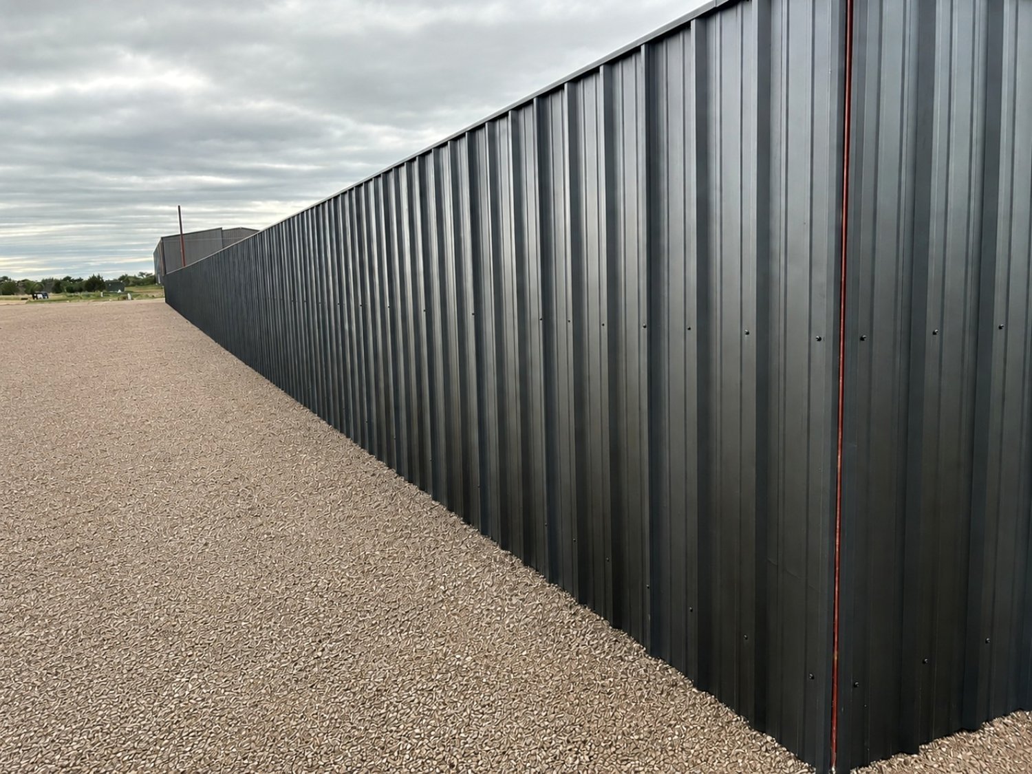 Black R-panel privacy fence