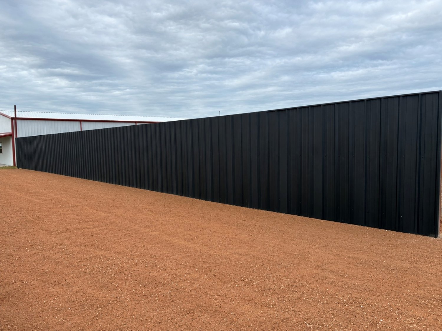 Black R-panel privacy fence